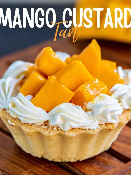 Our Mango Custard Tart is a bite of sunshine. A buttery, crisp tart shell is filled with creamy custard and topped with a generous amount of fresh, juicy mango.