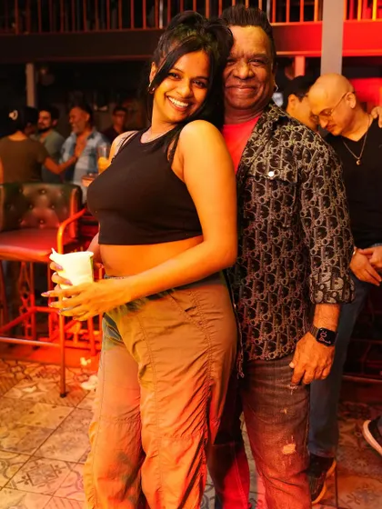 Posing with a fan at the party.