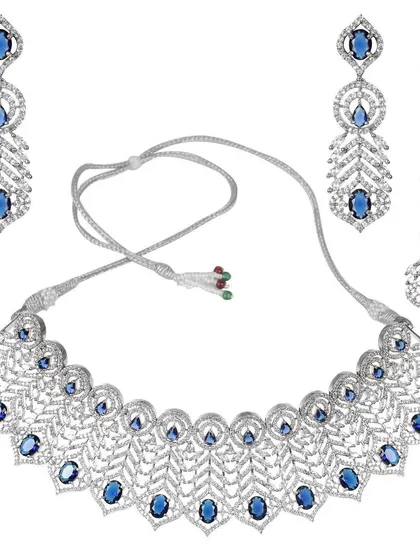 This is for when you need a complete, show-stopping look. This silver-plated American Diamond necklace set, with its intricate leaf pattern and stunning blue stones, comes with matching earrings and a maang tikka.