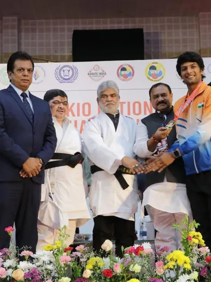 With my son, Pranay, and other officials during a medal ceremony at the KIO National Championship in Telangana. These events are a celebration of the hard work of our entire karate community.