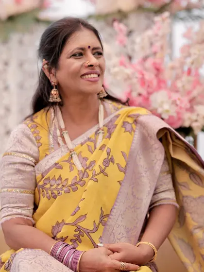 A candid moment showing my handcrafted pearl necklace. I believe jewellery should tell a story, just like the saree it's worn with.