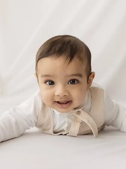 Tummy time pro. At six months, babies are stronger and can push up, making for great expressions and dynamic photos.