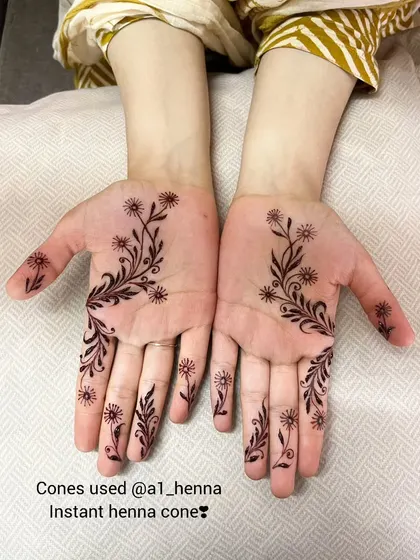A delicate floral vine created with my instant henna cones, showing that even minimal designs can have a rich, beautiful color.
