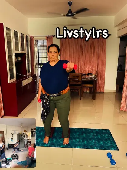 A client performs a front raise with light dumbbells, an exercise that targets the front of the shoulders. The inset shows her progress over time.