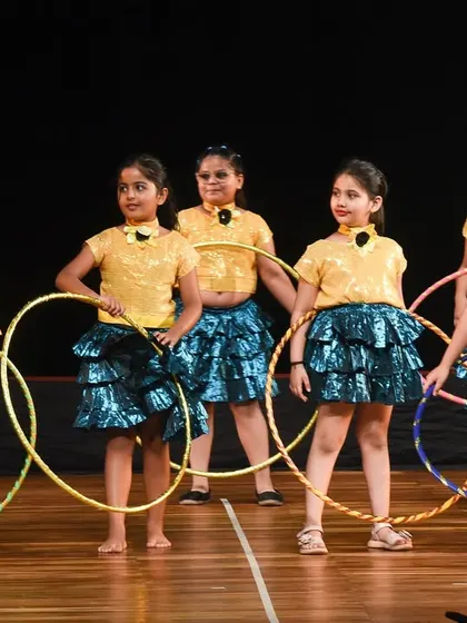 The hoop dance group posing together, showcasing their teamwork and the fun they have learning a new skill.