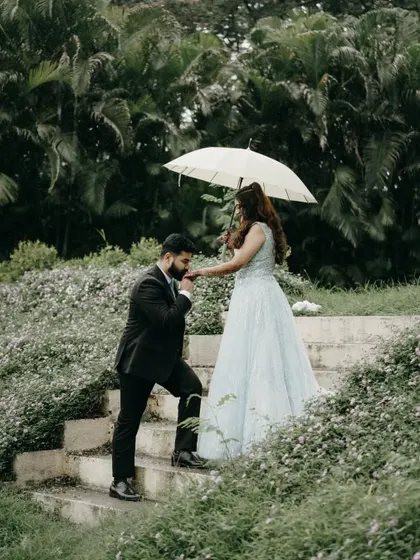 A chivalrous gesture of him kissing her hand. This is a timeless, romantic pose that is perfect for an engagement shoot.