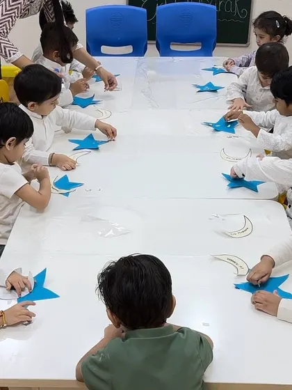 A classroom view of our Yellow Butterfly class engaged in their Eid craft. We provide a structured yet creative environment for festival-based learning.