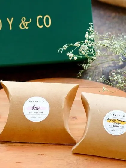 The beautifully packaged Rose and Turmeric Orange soaps from the 'Radiant Diwali Treasures' box.