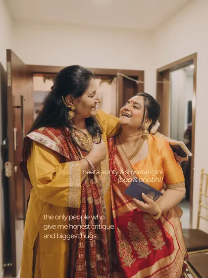 Two family members sharing a laugh. These honest critiques and big hugs from loved ones are what we cherish, and our styling aims to create an environment where these moments can flourish.