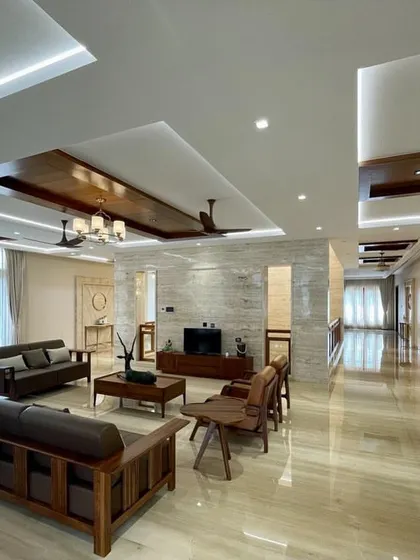 The open-plan living and family area in the Tirupur residence, showing how we create distinct zones for different activities within a large, flowing space.