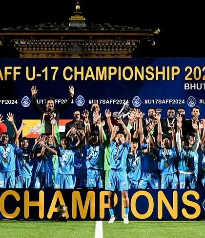 The entire Indian U17 team and staff celebrate on the podium as SAFF U-17 Champions. A proud moment for everyone involved.