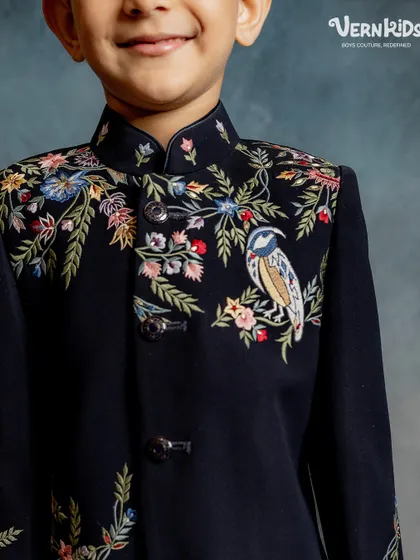 We believe luxury is in the details. This close-up highlights the delicate, handcrafted bird and floral embroidery that makes our Indo-western pieces true works of art, stitched with care and precision.