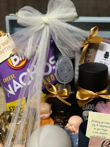 A close-up of the farewell hamper, showing the detail of the wrapping and the personalized "wishing you much joy" card.