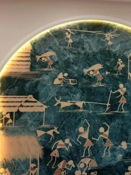 A unique wallpaper featuring Warli art, a traditional tribal art form, backlit within an arch to highlight its intricate details.