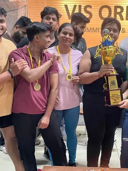 A close-up of our champions with the overall trophy. The joy and pride on their faces is what makes all the hard work worth it.