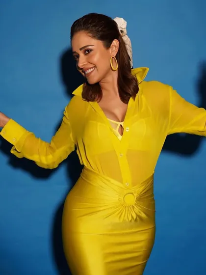 A happy, candid shot in the yellow outfit. The color is so vibrant and the smile says it all.