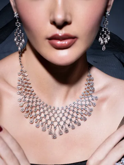 Diamonds are timeless, and styling them is about letting their brilliance shine. In this shoot for Myeves24, I focused on creating an elegant and classic look, using soft lighting and a simple backdrop to highlight the intricate design of the diamond necklace and earrings.