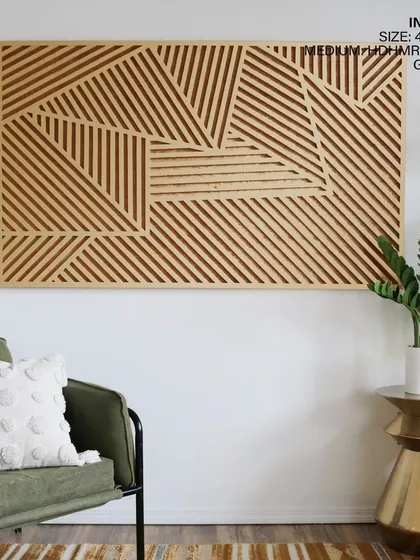 In a golden wood finish, the geometric panel feels warm and inviting. It pairs beautifully with the green accent chair and metallic side table, showcasing its versatility in different decor schemes.