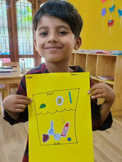 This young scientist proudly displays his float and sink activity chart. We use worksheets to help solidify the practical knowledge gained from experiments.