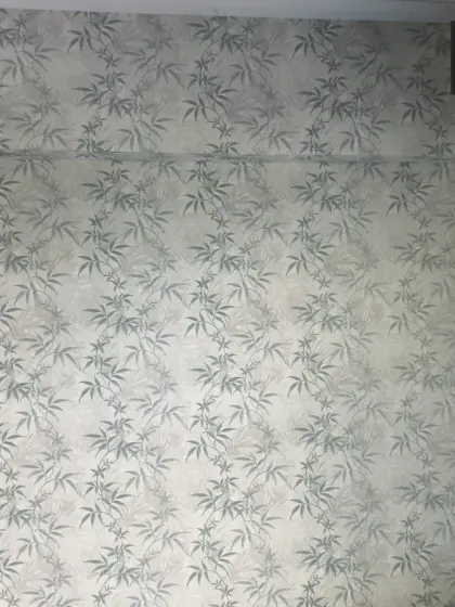 A calm and subtle bamboo-patterned wallpaper. This design is ideal for creating a peaceful, zen-like atmosphere.