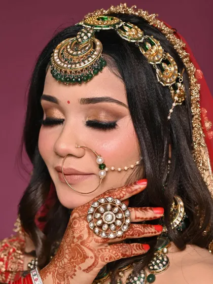 Another angle of the intricate eye makeup, highlighting the shimmer and depth. This is a popular choice for evening wedding ceremonies.