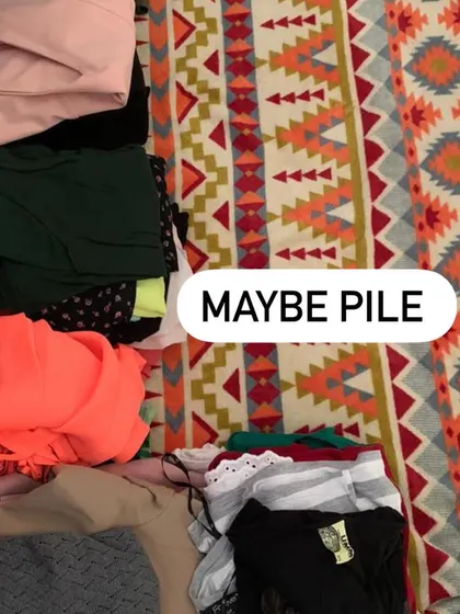 The "Maybe Pile" is for items we're not sure about. We'll try styling them in new ways to see if they can earn a spot back in the closet.