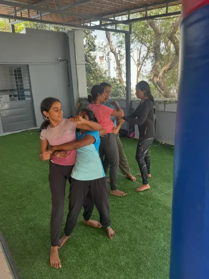 A group of participants practicing escapes from body holds. Training with different partners helps you adapt to various body types and levels of resistance.