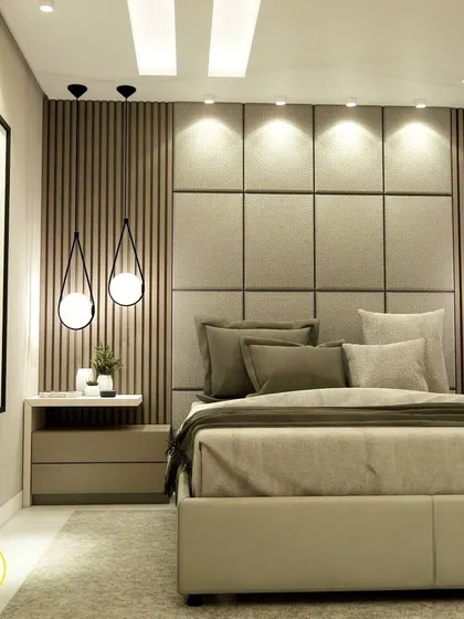 Another angle of the stunning upholstered and fluted headboard, a centerpiece of this master bedroom design.