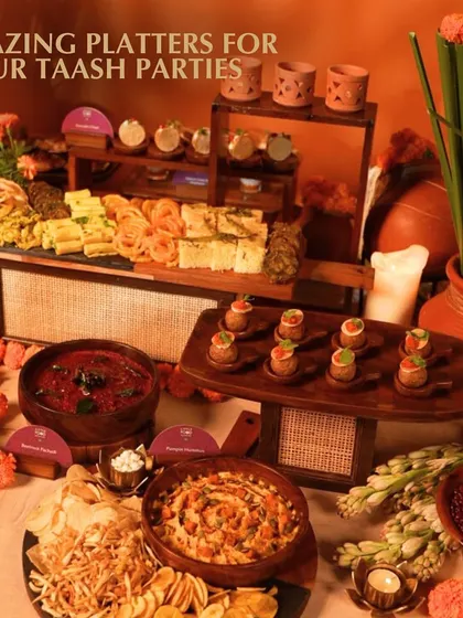 Our Indian grazing platters are perfect for your Diwali taash parties. This image shows a full spread of snacks and dips available for delivery, ensuring your guests have plenty to munch on.