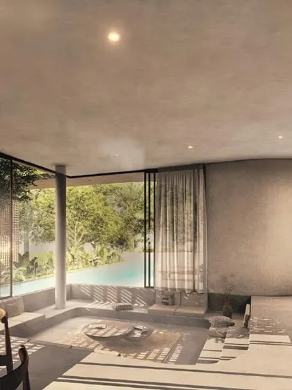 The interior of the House of Veils flows softly within itself. The space features a sunken conversation pit, a double-height bar with filtered screens, and a warm wooden dining area, all connected by curving forms and earthy finishes.
