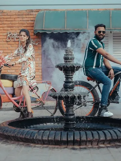 A fun shot with bicycles in front of a studio set designed to look like a European street cafe. Props like these add a playful element to the shoot.