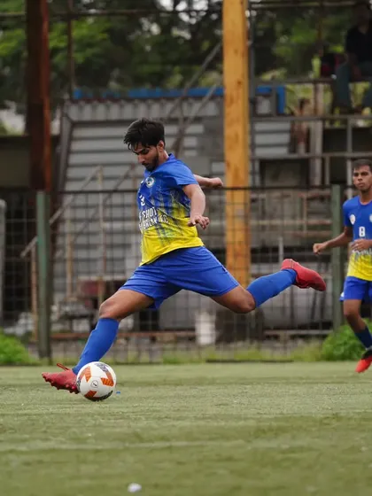 Our midfielder strikes the ball with perfect technique, demonstrating the quality we instill in our players.