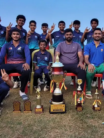Our victorious team with coaches and their impressive collection of trophies after winning the Dasara Cup in Hubli.