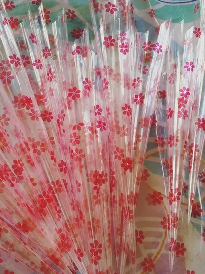 The process of creating henna cones starts here, with these empty, beautifully patterned cellophane sheets. I roll each one by hand to create the perfect vessel for my organic paste.