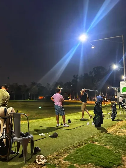 The game doesn't stop when the sun goes down. Our floodlit driving range means your corporate or private event can continue late into the evening, offering a unique night golf experience in Gurugram.