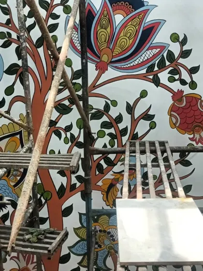 A close-up of the hand-painted Kalamkari flowers and branches. Each element is carefully crafted to honor the traditional art form while fitting a modern home.