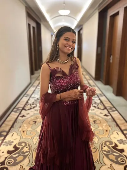 The unique neckline and sequin work on this maroon gown make it a modern and stylish choice. It’s a perfect rental for making a sophisticated statement.