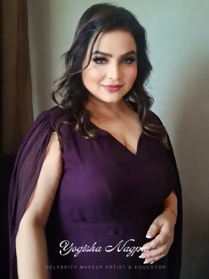 Another angle of this lovely soft glam makeup. The side profile highlights the gentle contouring and the soft waves in her hair, completing the look.