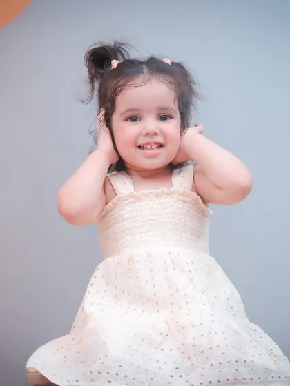 A slightly different take on this adorable two-year-old's portrait, showing her sweet smile.