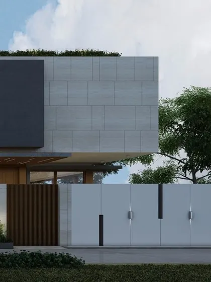 The entrance to 'The Courtyard House' is marked by a simple, elegant gate and a dark, recessed panel on the main facade. The design emphasizes clean lines and a restrained material palette for a timeless modern aesthetic.