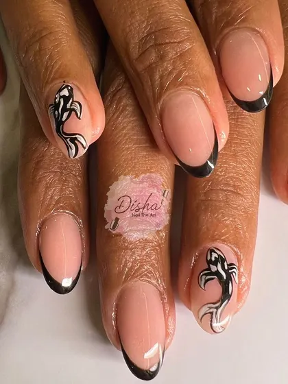 A unique take on the French manicure. This design features classic black tips with two accent nails showcasing beautifully hand-painted koi fish for a touch of artistic flair.