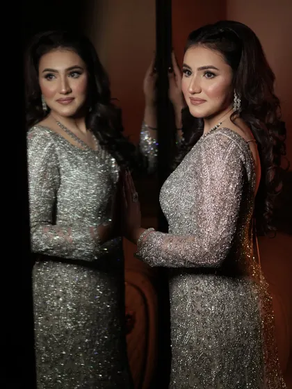 An unfiltered picture of my client looking stunning in a silver gown. The makeup is soft and glowing.