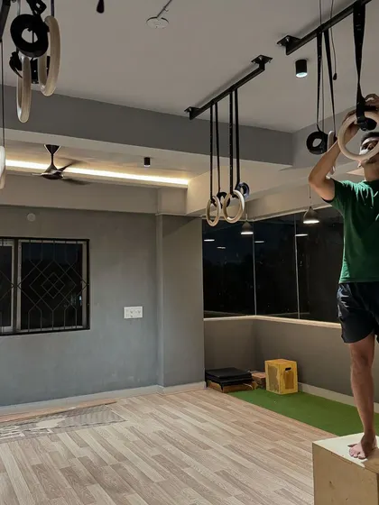 Setting up the gymnastics rings. These are a core part of our training philosophy, so getting them just right was essential.