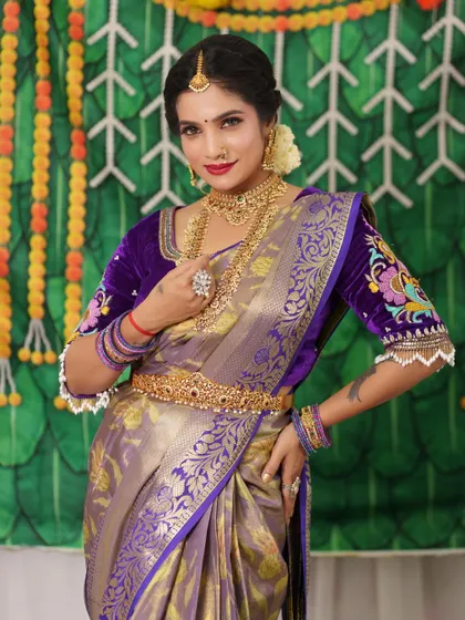 A stunning bride in a rich purple saree, adorned with a full set of my antique jewellery. The contrast of colors is beautiful.