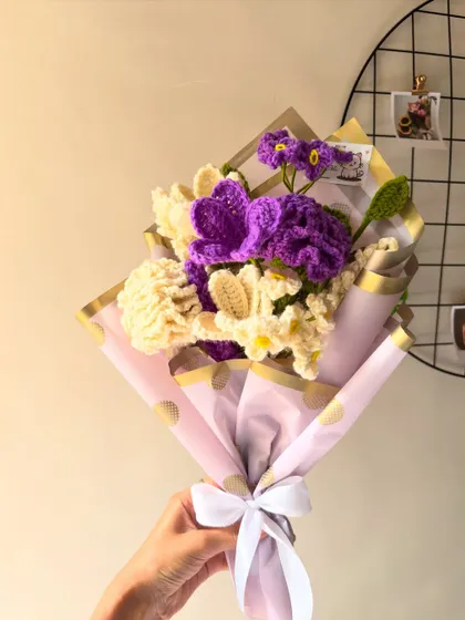 A beautiful custom bouquet I made last week, featuring purple and white flowers. The wrapping adds a final elegant touch.