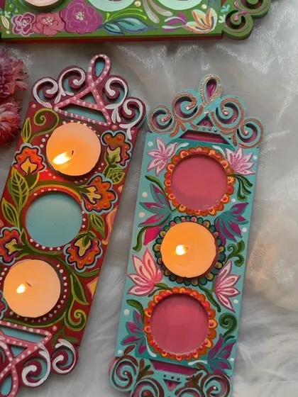 Two of our new three set tea light holder designs. Each one is hand painted with a unique floral pattern, making them a beautiful addition to your festive decor.