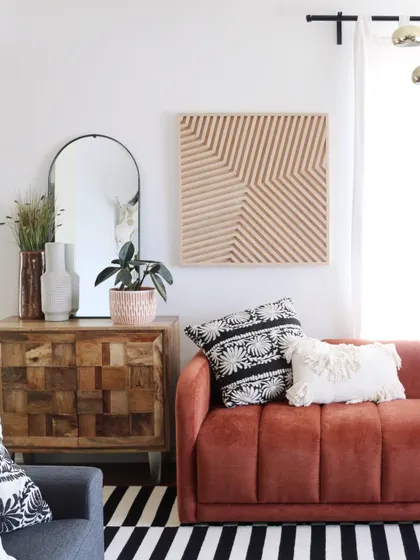 This geometric wood art piece, with its clean lines and natural finish, adds texture and interest to a modern living room without overwhelming the space.