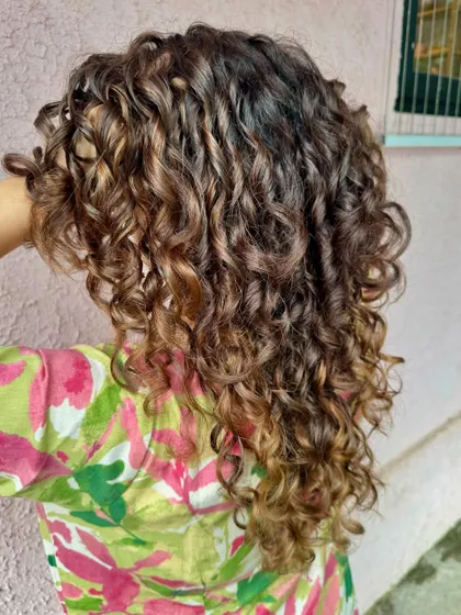 Chocolate swirl. A hair transformation for these pretty curls with a non-bleach color. (No filter)