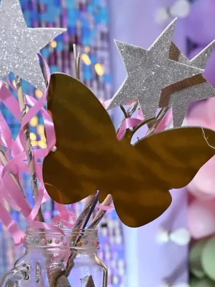 It's all in the details. These custom wands with glittery stars and butterflies were part of a fairy-themed party, adding a touch of magic for the little guests.