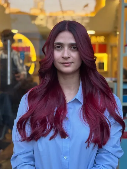 Shades that speak louder than words. This magenta-red look is vibrant and playful, perfect for anyone looking to express their personality through their hair.